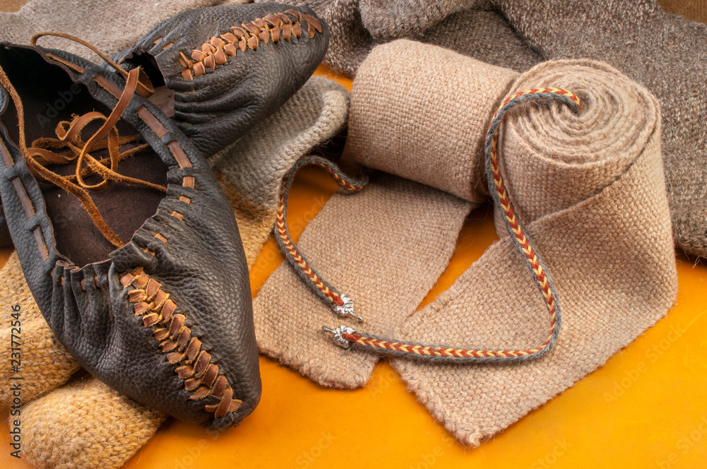 Fototapeta premium Set of ethnic Slavic clothes on red fabric. Subject photography.