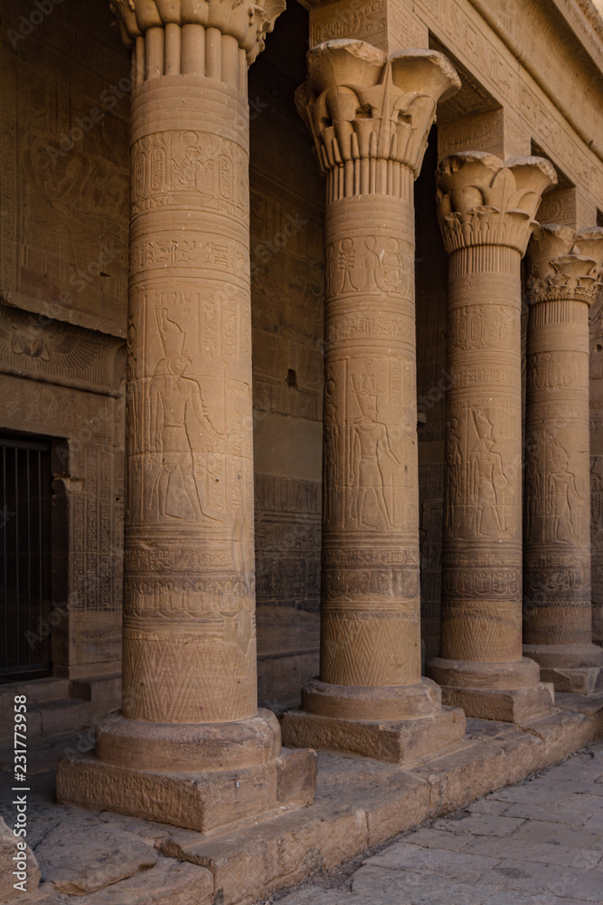 Columns with relief carving in the forecourt of the Temple of Isis at Philae, Aswan, Egypt