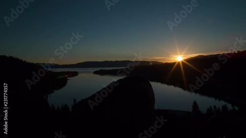 Sunrise over mountains and lake