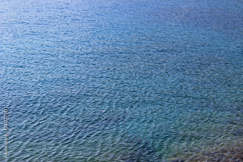 Deep blue sea water background reflection