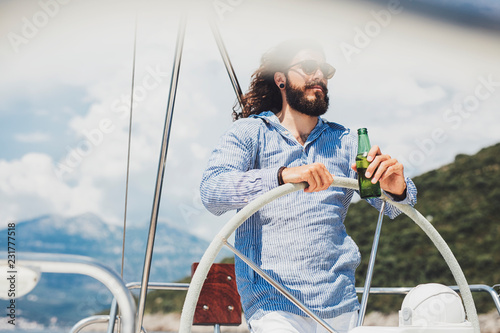 Portrait of Long-haired Man on Sailing Boat photo