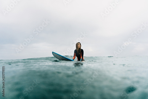 Woman posing dreamily on board