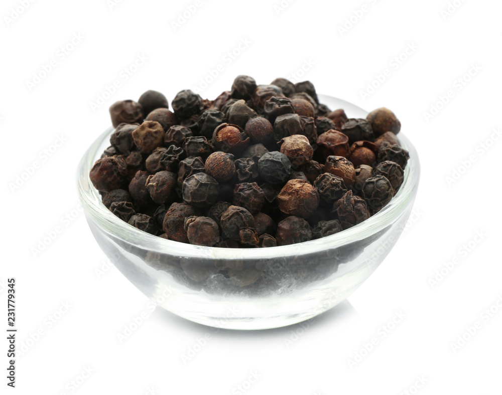 Glass bowl with black pepper grains on white background Glass bowl with black pepper grains on white background
