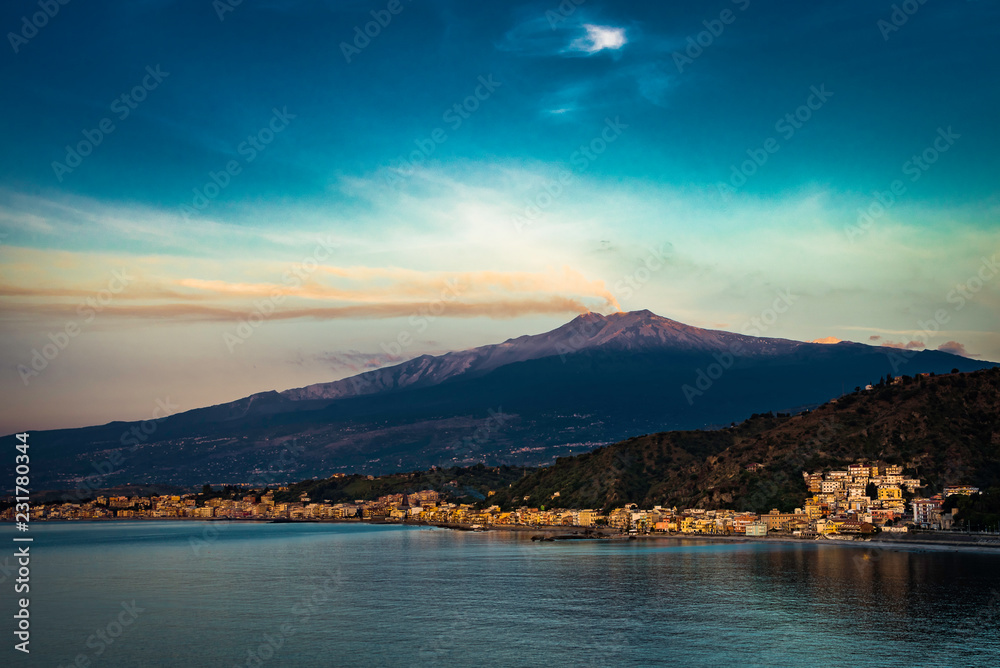 Mount Etna smoking above the Mediterranean Sea 