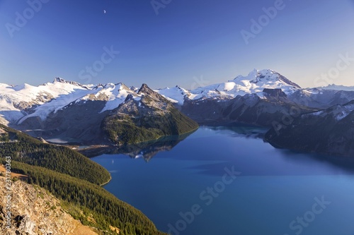 Fototapeta Naklejka Na Ścianę i Meble -  Scenic Landscape View of Blue Garibaldi Lake and Snow Covered Coast Mountains from Panorama Ridge in Sea to Sky Corridor between Squamish and Whistler, British Columbia Canada