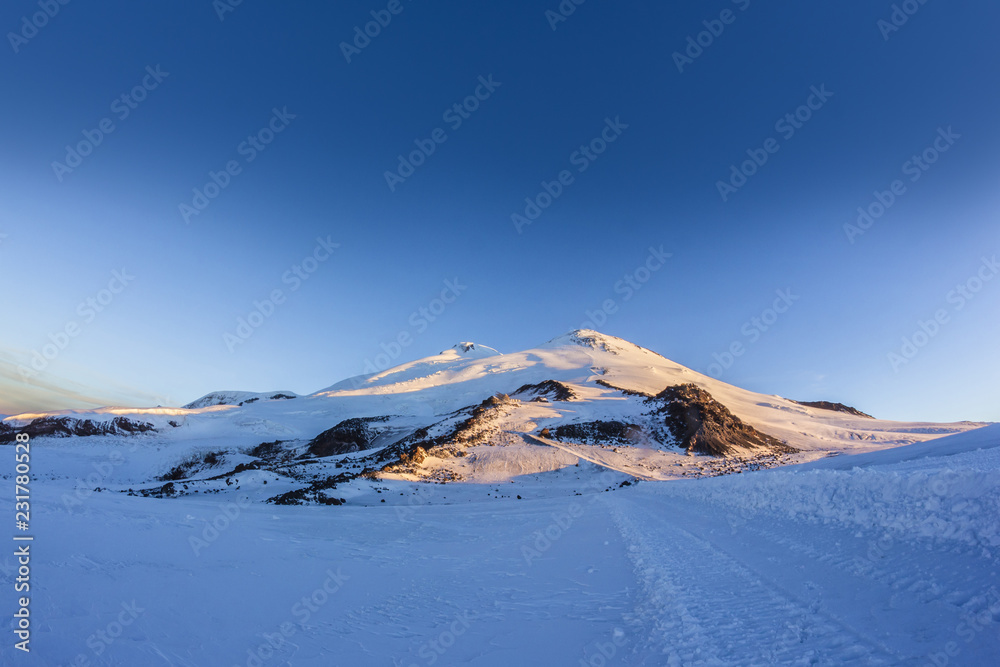 Mount Elbrus against the blue sky at dawn