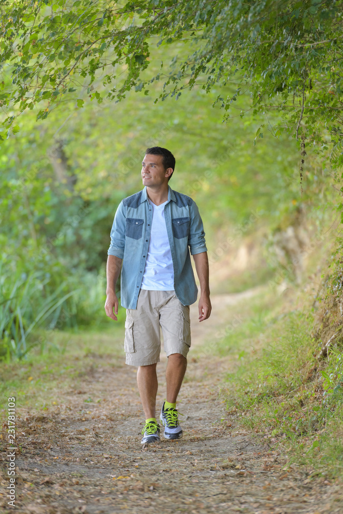 Man walking along country path Man walking along country path