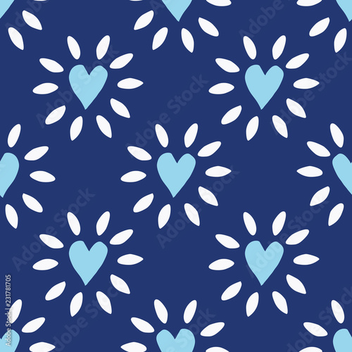 Charming folk art illustrations of glowing hearts from Mexico. Indigo blue, sky blue and white seamless vector pattern that is perfect for textiles, fashion, home decor, gift wrapping paper and cards.