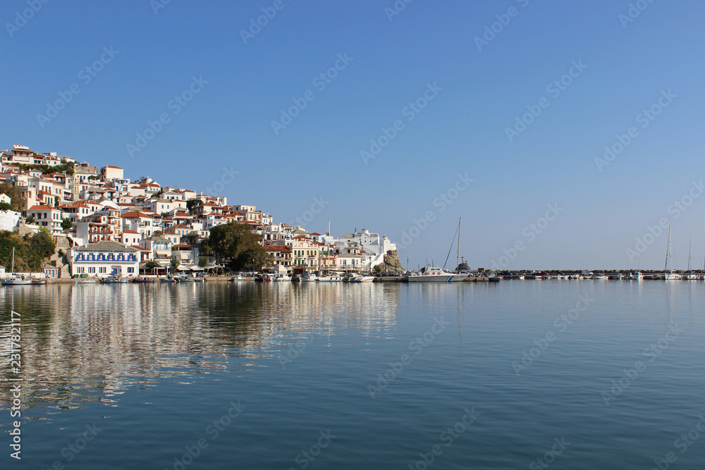 Skopelos island greece mediterranean town panorama harbor port reflection