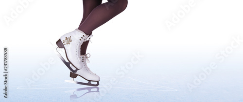 Woman legs in ice skating boots