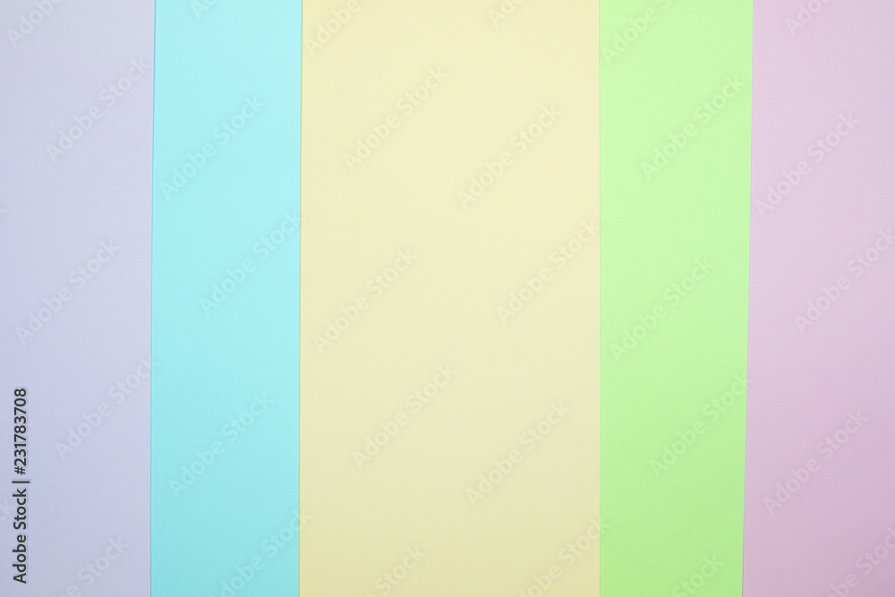 Fashionable  pastel colored paper flat lay top view, geometric background texture, pink, purple, yellow, beige, green and blue.