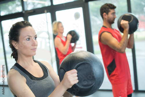 group of sport people working out with medicinal ball