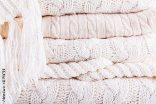 White knits pile. Warm cozy home concept
