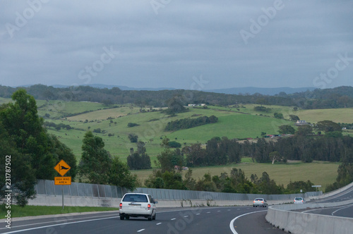 Highway with cars and road signs. Road trip in Australia