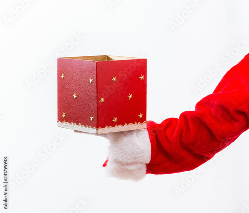 Santa opening a gift box isolated on white background