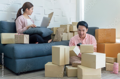 Young business couples startup family business, online marketing packaging and delivery scene. © stockphotokae