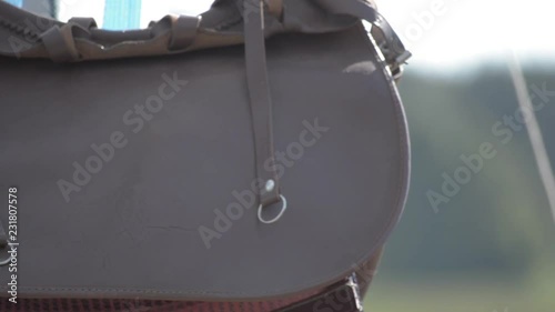 Leather hunting bag with brown ornament with patronage. Medium close up. photo