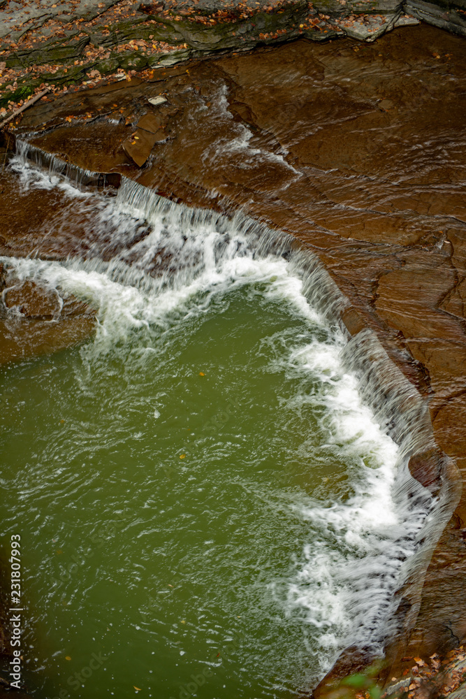 Waterfall cascading over the rocks in Watkins glen state park Waterfall cascading over the rocks in Watkins glen state park