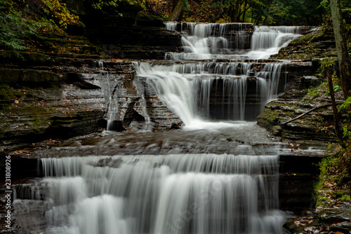 Waterfall drapes the rocks in gorge at Watkins Glen State Park