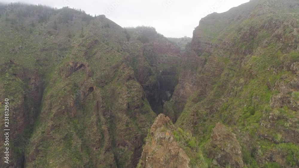 TENERIFE, SPAIN - MAY 18, 2018: Aerial view of rocky mountains in Hell gorge, Canary islands TENERIFE, SPAIN - MAY 18, 2018: Aerial view of rocky mountains in Hell gorge, Canary islands