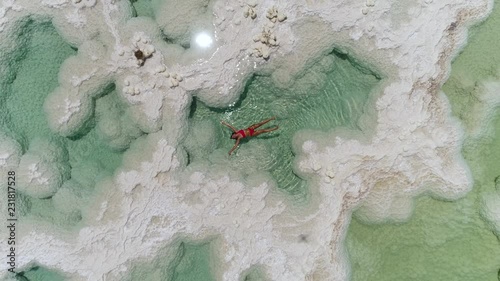 woman floating in the Dead Sea salt