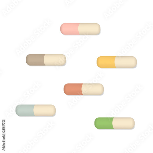 Colored pills - medical capsules isolated on white background