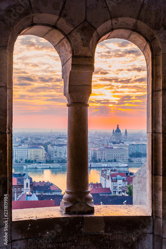 Fisherman's Bastion is an important landmark of Budapest. View of the city from a height, panorama at sunrise. Monument of historical architecture. The Danube River is far away. Morning in the fog. Wh