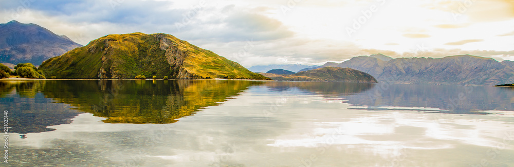 Panoramic view at the lake with reflection in autumn color; NEW ZEALAND, APRIL 2017