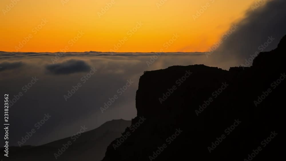 Timelapse of a sunset with clouds moving in the mountains volcano Teide, Tenerife, Canary Islands