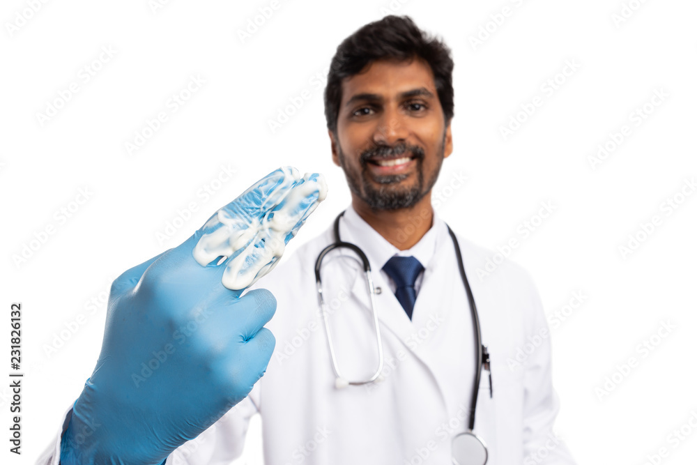 Doctor with cream spread on fingers. Doctor with cream spread on fingers.