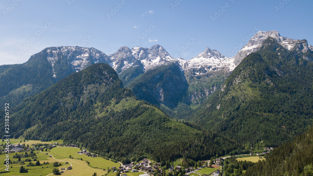 Aerial view of mountain range with snow in the alpine mountains