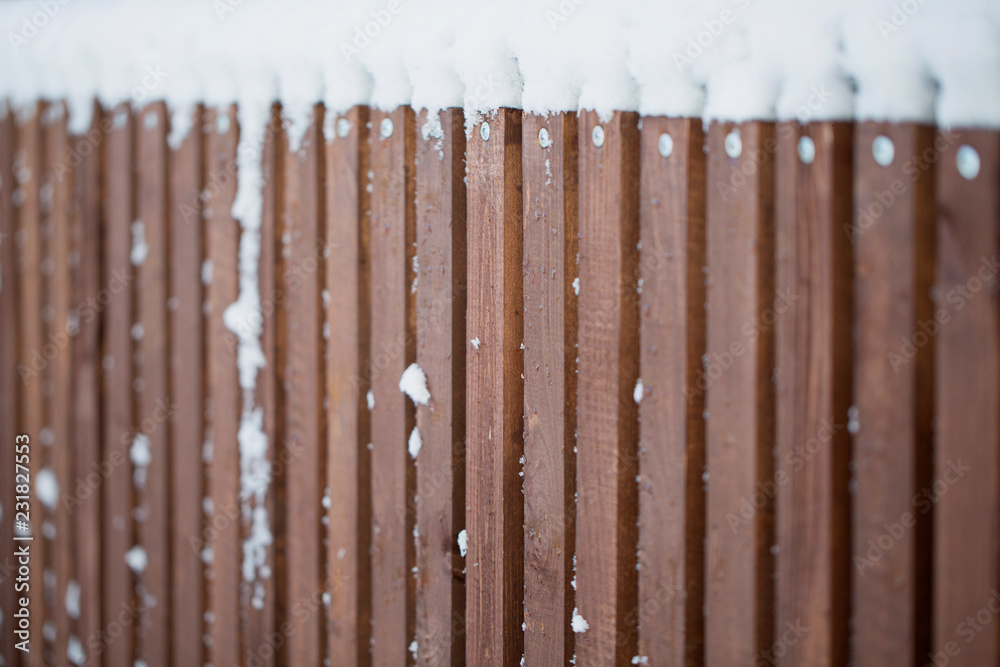 snow on a wooden fence as a background image