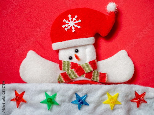 Cute snowman wearing Santa Claus hat © tete_escape
