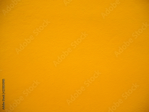 Photo of cement orange wall texture background, wallpaper, copy space and backdrop.