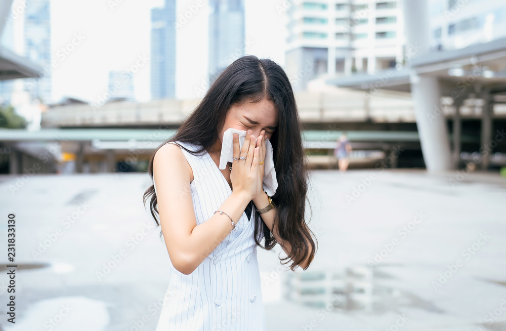 Εκτύπωση καμβά Woman sneeze on street because pollution,Young female got nose allergy