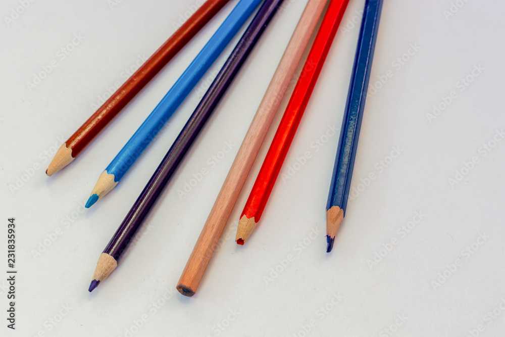 Fototapeta premium close-up old colored pencils on white background
