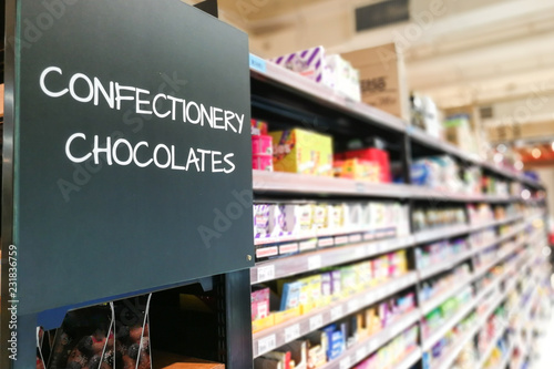 Confectionery, chocolate grocery categoy aisle at supermarket