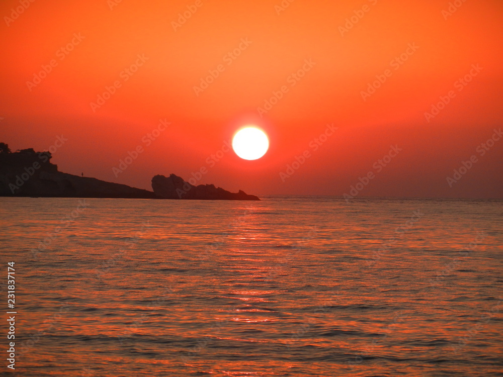 fire sky at sunset in Gialiskari, Ikaria island, North Aegean, Greece