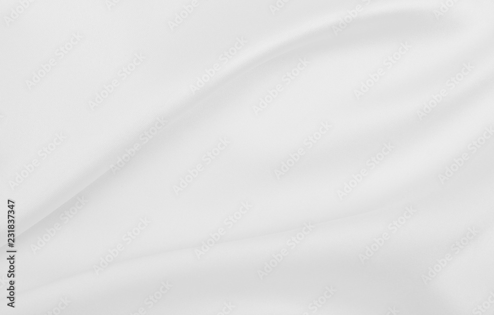 Smooth elegant white silk or satin luxury cloth texture as wedding background. Luxurious Christmas background or New Year background design Smooth elegant white silk or satin luxury cloth texture as wedding background. Luxurious Christmas background or New Year background design