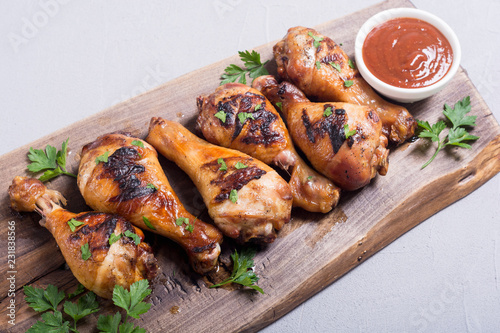 Grilled chicken legs with tomato sauce
