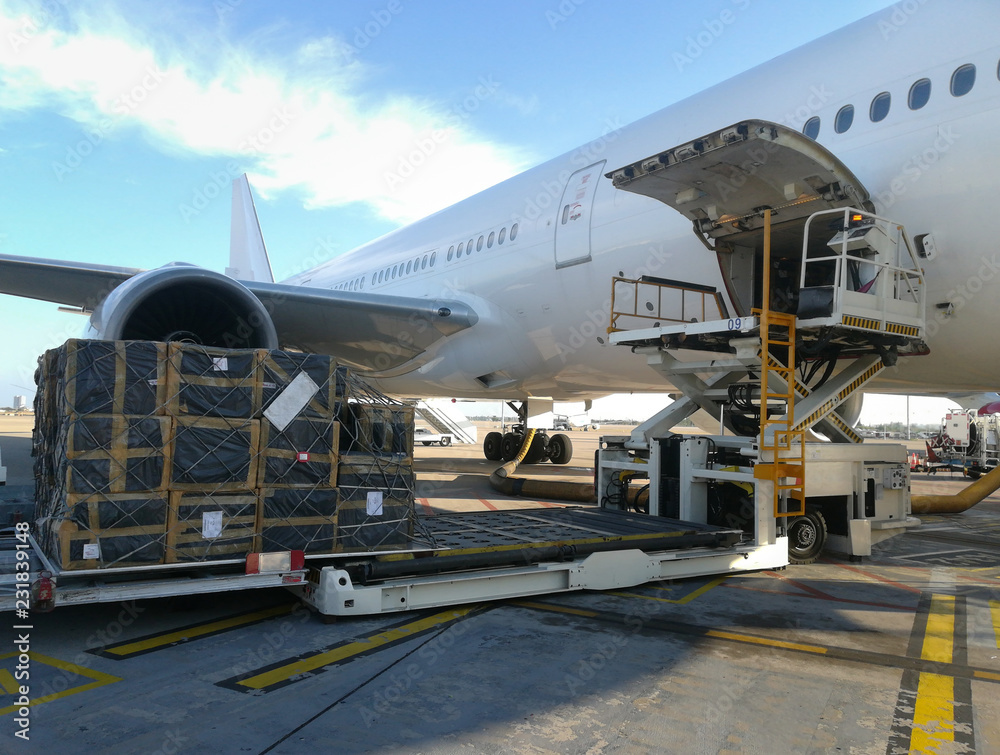 Process of cargo handling. Parcels loading with high loader Process of cargo handling. Parcels loading with high loader