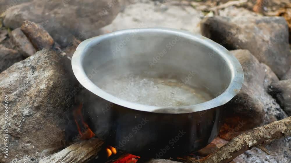 Boiling Water In The Pot Over A Campfire Boiling Water In The Pot Over A Campfire
