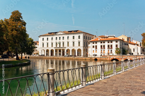 Treviso, Italy August 7, 2018: the river flows among the old buildings of the city. © makam1969