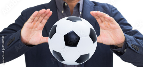 Businessman hand with soccer ball © littlestocker