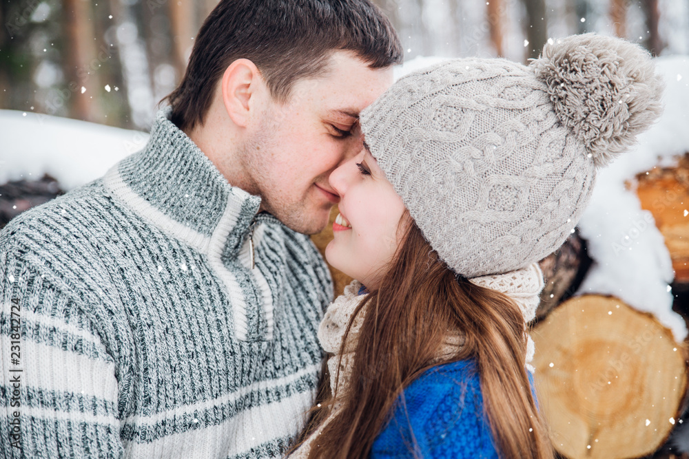 outdoor portrait of young sensual couple in cold winter wather. love and kiss outdoor portrait of young sensual couple in cold winter wather. love and kiss