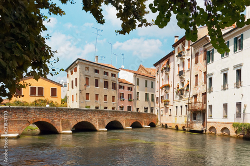 Treviso, Italy August 7, 2018: the river flows among the old buildings of the city.