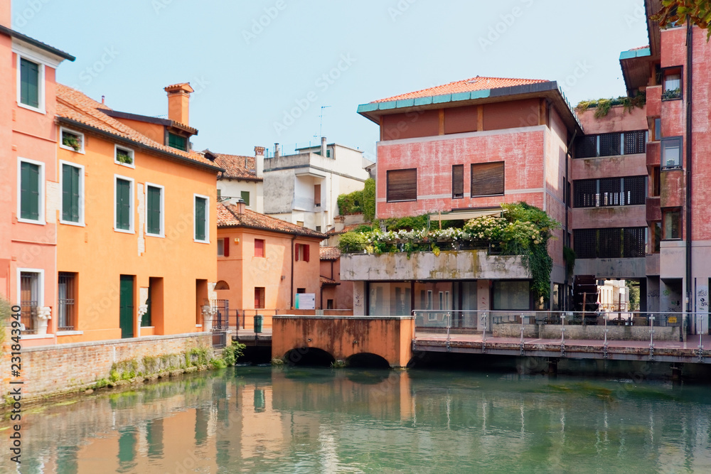Treviso, Italy August 7, 2018: the river flows among the old buildings of the city.