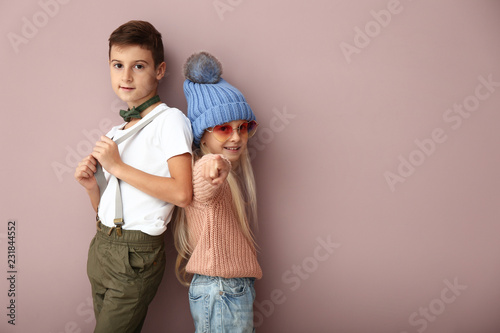 Cute boy and girl in fashio...