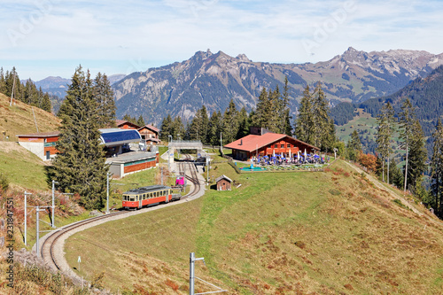 Incoming train from Gruetschalp (Grütschalp) at Winteregg, Jungfrau Region, Switzerland photo