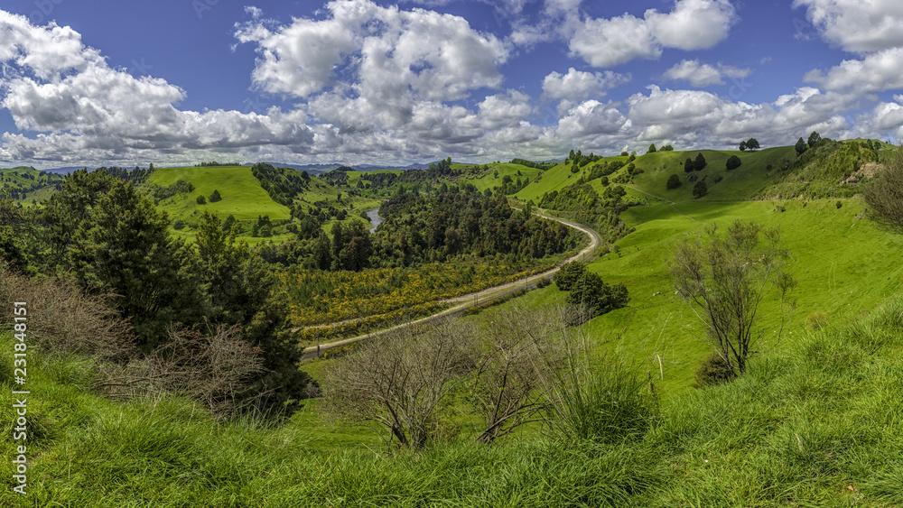 a railway track winding through green countryside